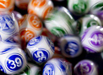 Keno numbers depicted on a pile of bingo balls