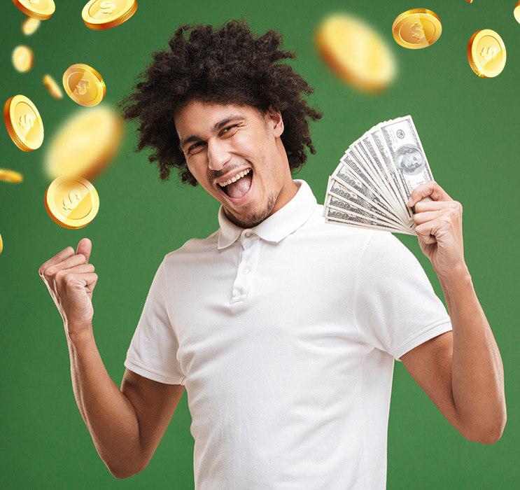 Male Keno player cheering and holding money with gold coins falling in green background